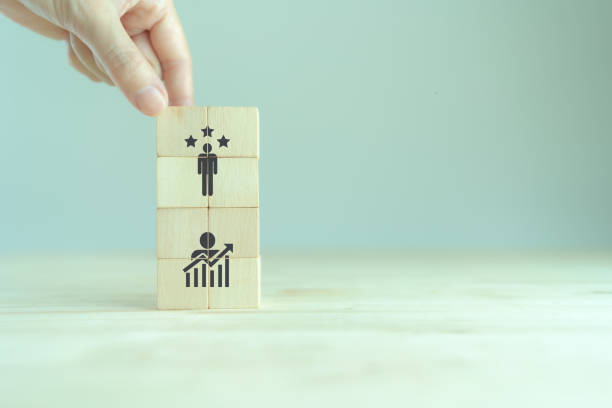 istock Personal development, growth mindset and promoted employee. Human resource management and training. Enhancing competency, self learning, experience. Wooden cubes with improvement and promoted icons. 1400743490