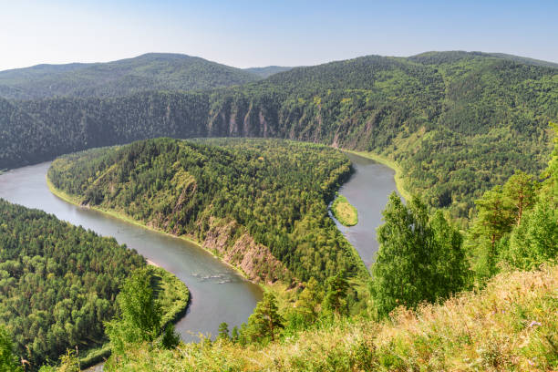 istock Awesome view of scenic river among evergreen woods 1400743568