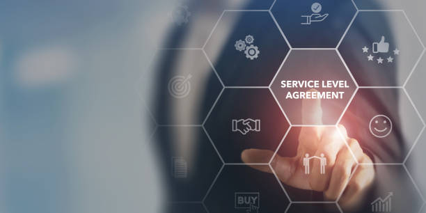istock Service Level Agreement (SLA), business concept. Service performance tracking to reduce the uncertainty the customer in process. Businessman touching on SLA with smart screen background. 1400744669