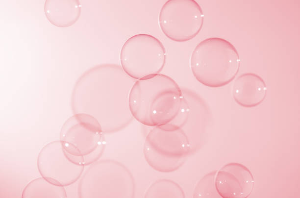 istock Abstract Beautiful Pink Soap Bubbles Background. Soap Sud Bubbles Water. 1400748415