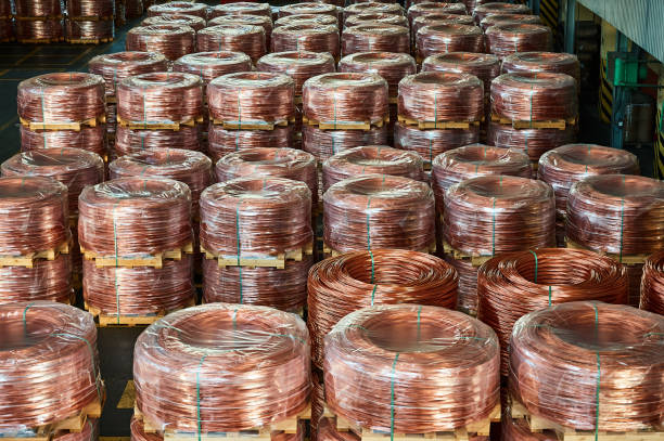istock Rows of wrapped copper cable coils in light plant warehouse 1400748517