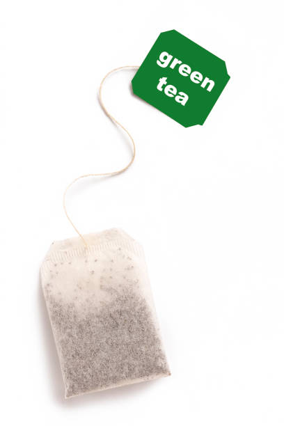 istock green tea bag isolated on white. 1400751546