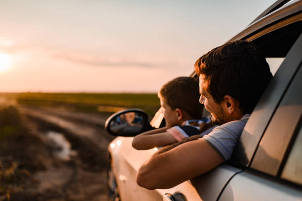 istock Beautiful father and son enjoying on a road trip 1400751722