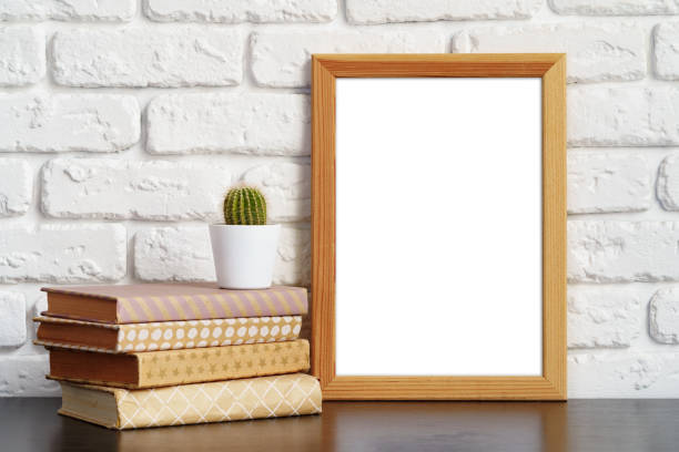 istock Books with picture frame on wooden table 1400751773