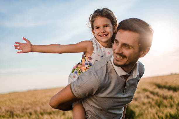 istock Father and daughter enjoying nature 1400751978