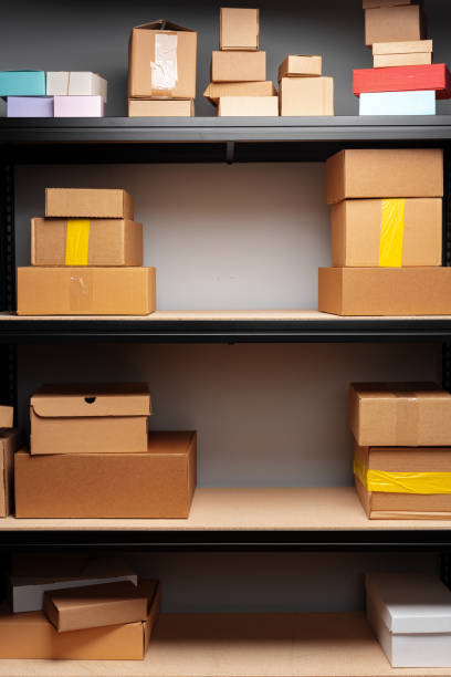 istock Rows of shelves with cardboard boxes in modern warehouse 1400755372