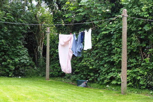 istock Freshly washed bed sheets drying on a washing line 1400757097