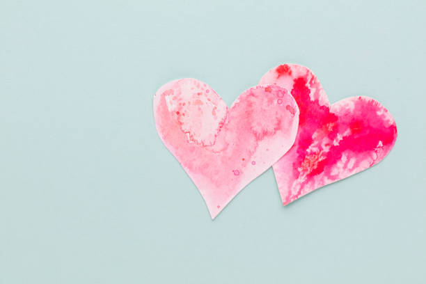 istock Cut the heart shaped paper, put on a pastel background. 1400761778