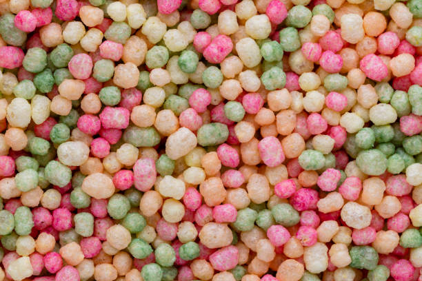 istock Thousands sprinkles tiny sugar beads for decorating cakes and desserts background. 1400761805