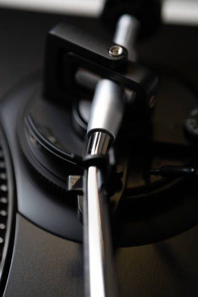 istock Turntables tone arm. Professional dj vinyl record player device in close up 1400763403