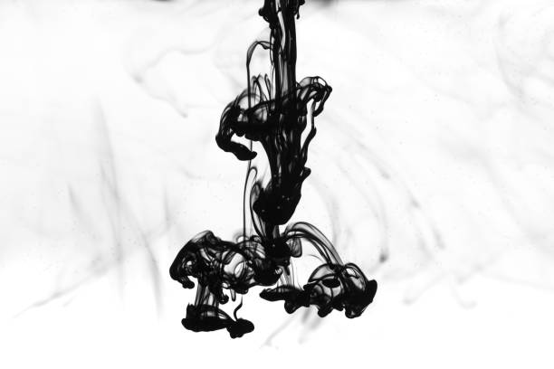istock Black ink dropped into water painting background。 1400764188