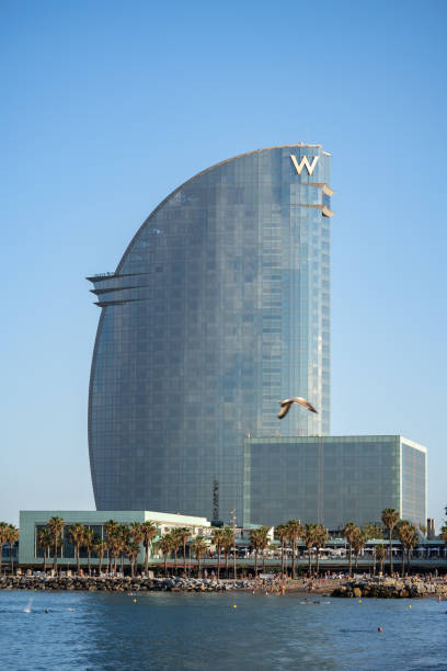 Aerial view of Barceloneta and W hotel from seaside. Barcelona, Spain - May 29, 2022 stock photo