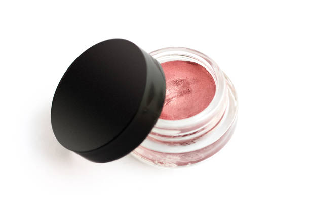 Pink cream eye shadow. Decorative cosmetics on white background