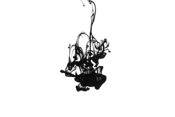 Black ink dropped into water isolated on white background。