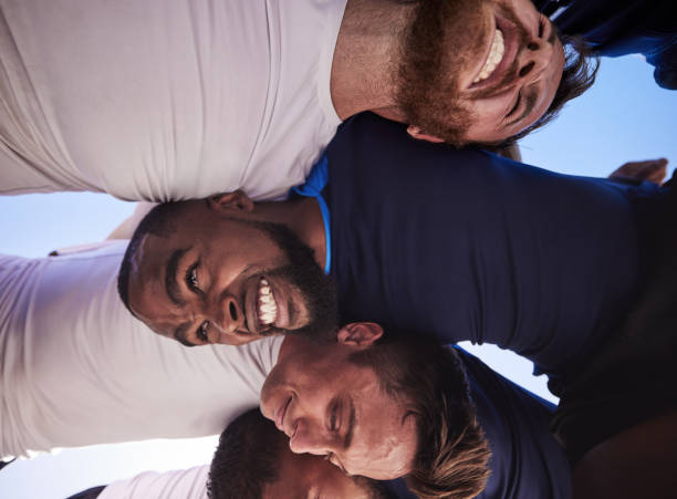 istock Below two opponent rugby teams contesting a scrum during a match outside on a field. Rugby players battling and fighting to win the ball while competing for possession in a game. Strength and power 1400766270