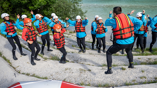 Instructor talking to group of friends before the rafting.