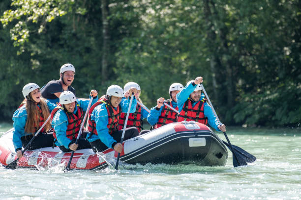 istock Whitewater rafters rowing their raft in river 1400768519
