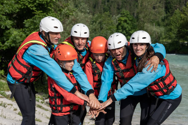 istock Group of rafter huddle at river 1400768523