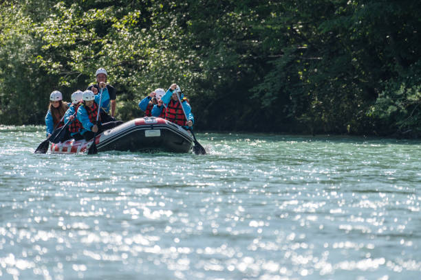 istock Whitewater rafters rowing their raft in river 1400768534
