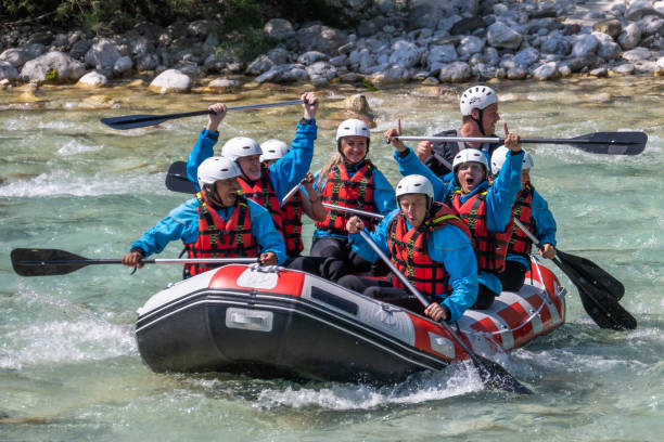 istock Group of people rowing their raft in river 1400768536