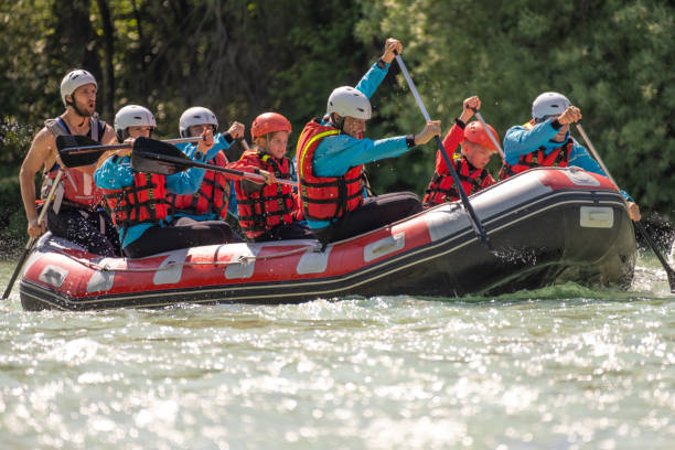 istock Group of people rowing their raft in river 1400768556