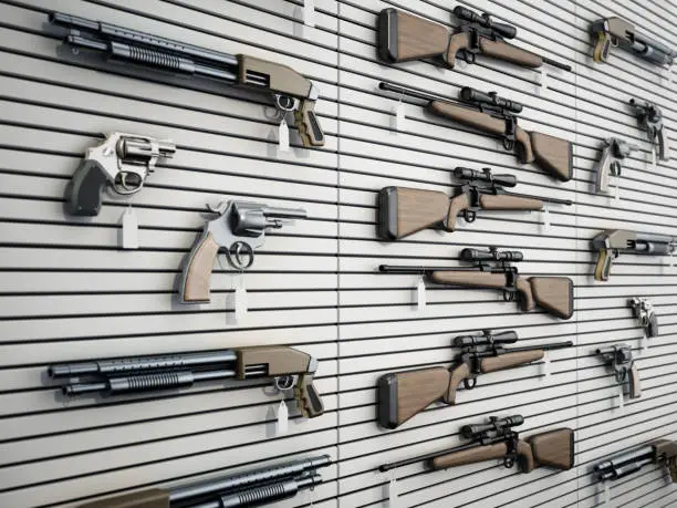 Fictitious firearms hanging on the wall of a gun store. 3D rendering.