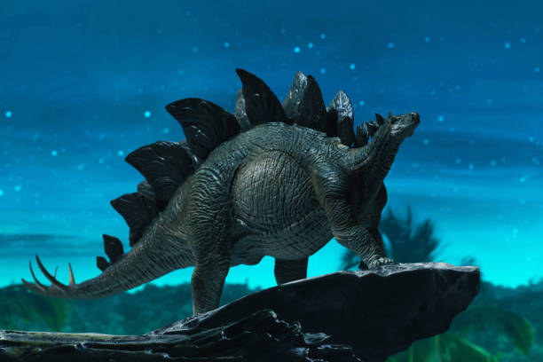 Dinosaur 3d rendering, Stegosaurus on top mountain stock photo