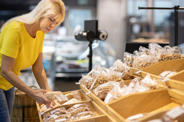 istock Blonde woman in supermarket 1400772215