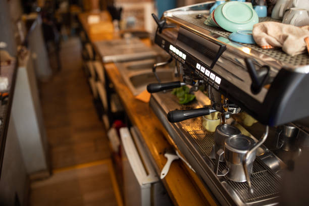 Barista at work in a cafe. Preparing pour over coffee