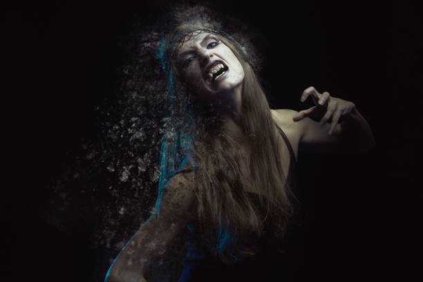 istock A young witch in agony, shouting and breaking into pieces, halloween horror 1400773929