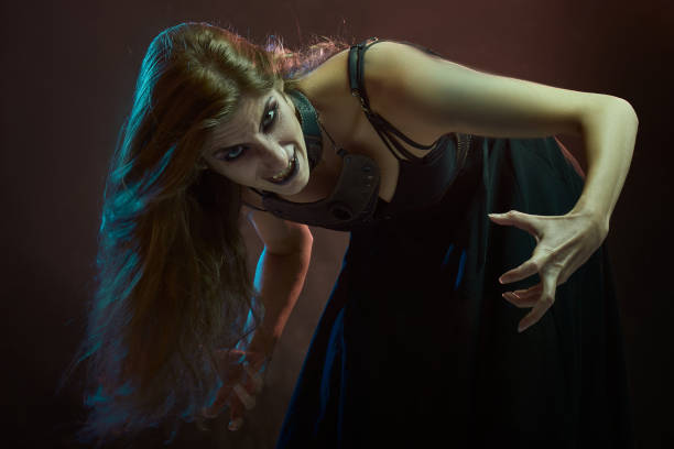 istock Dark sorceress casting a magic spell with an animal skull 1400774828