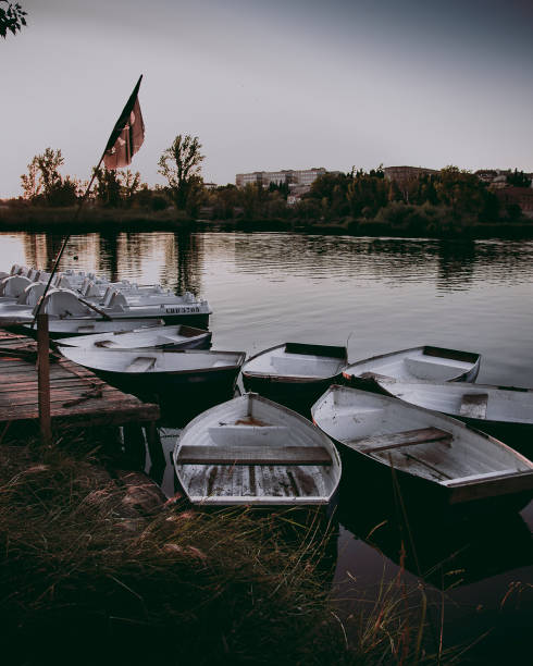 Sunset on a lake with boats moored on the dock