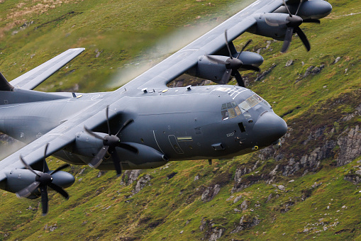 Wales, United Kingdom - 25th May 2022 - RAF (Royal Air Force) Lockheed C-130 Hercules transport plane carrying out low level flying in the Mach Loop.