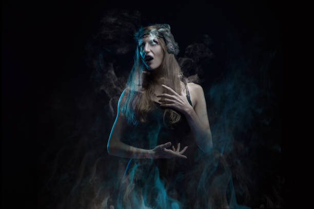istock A young witch in agony, shouting and breaking into pieces, halloween horror 1400775378