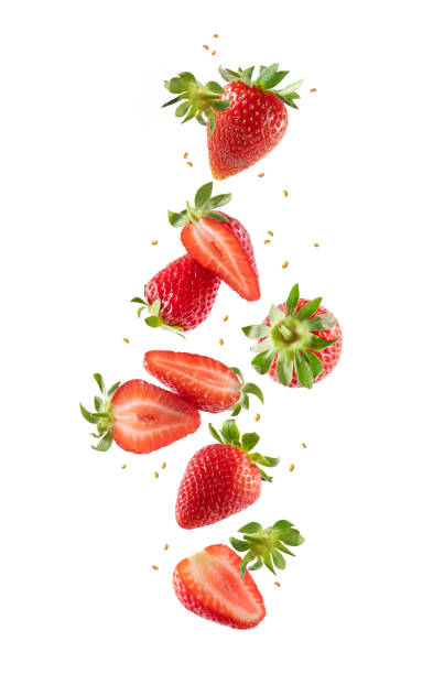 istock Whole and Sliced Fresh Strawberries in Air on White Background 1400777281