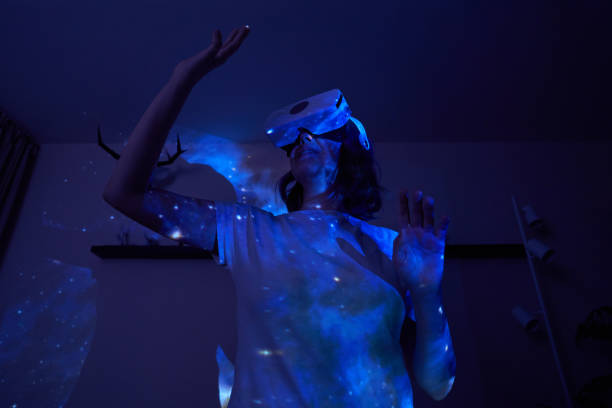 istock Woman is using virtual reality headset. Elements of this image furnished by NASA. 1400778052