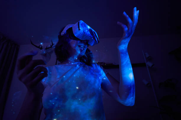 istock Woman is using virtual reality headset. Elements of this image furnished by NASA. 1400778077