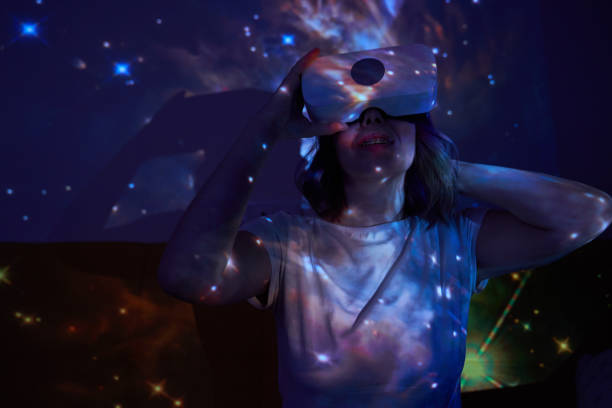 istock Woman is using virtual reality headset. Elements of this image furnished by NASA. 1400778085