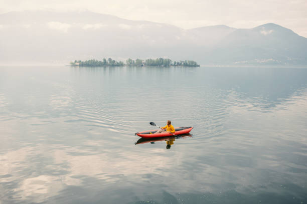 Man on a red canoe