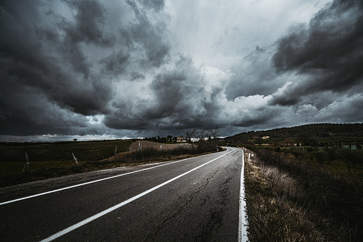 Asphalt road at stormy weather