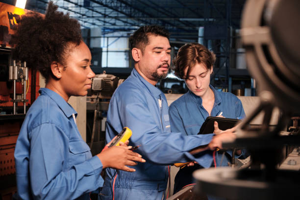 istock Engineer teams inspect machines' electric current at the industry factory 1400779700