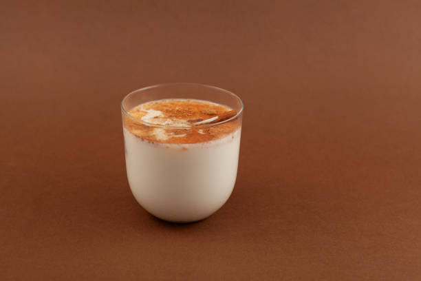 istock Glass of Salep drink on brown background. Selective focus, copy space. Salep, also spelled sahlep or sahlab. Popular Turkish drink 1400779764