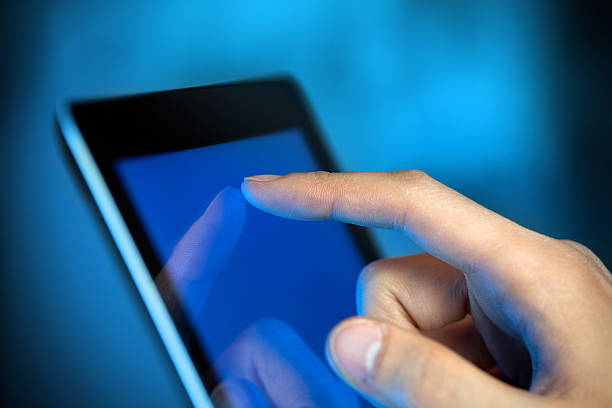 istock Finger pointing at the touch screen of a Digital tablet 140078178