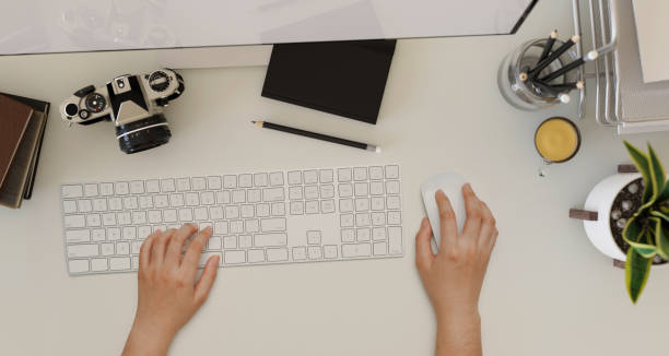 istock Overhead shot, A female hands typing on computer keyboard on a modern office workspace 1400782987