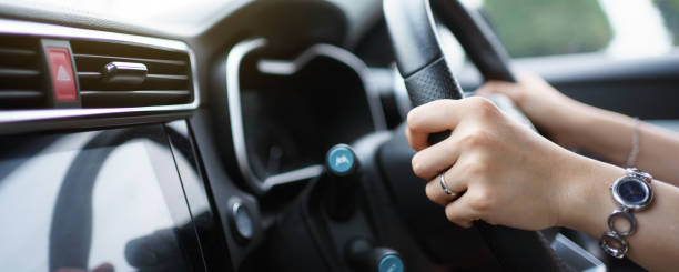 istock Woman driving a car. 1400783855