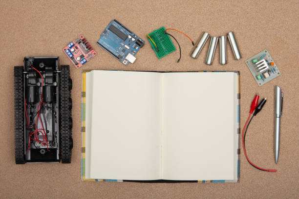 istock DIY robot competition ideas. STEM education for kids. A robot and an electronic board that can be programmed. 1400784218