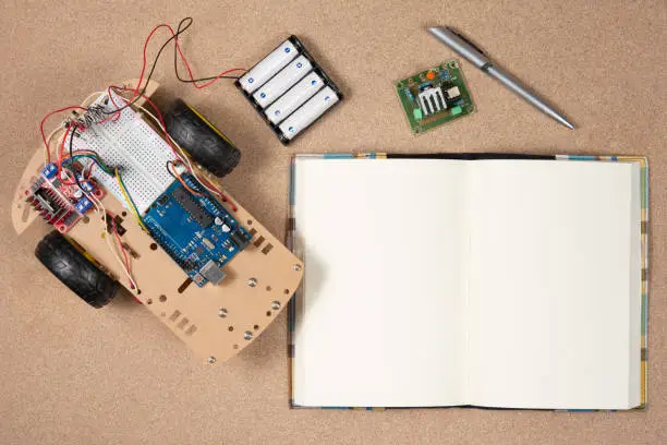 Photo of Line tracking robot competition ideas. STEM education for kids. A robot and an electronic board that can be programmed.