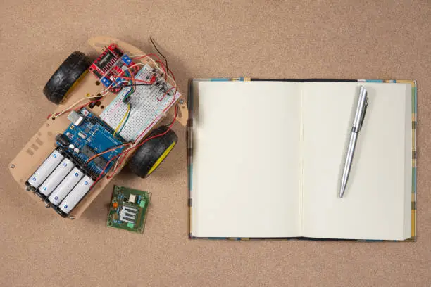 Photo of Line tracking robot competition ideas. STEM education for kids. A robot and an electronic board that can be programmed.