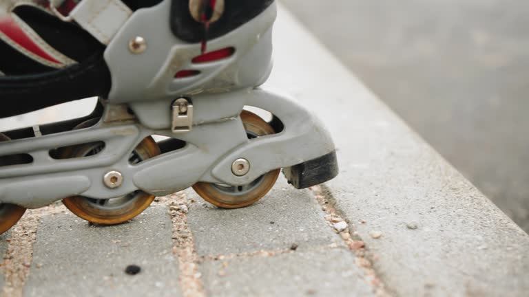 The guy's feet are wearing roller skates. Shooting videos in close-up