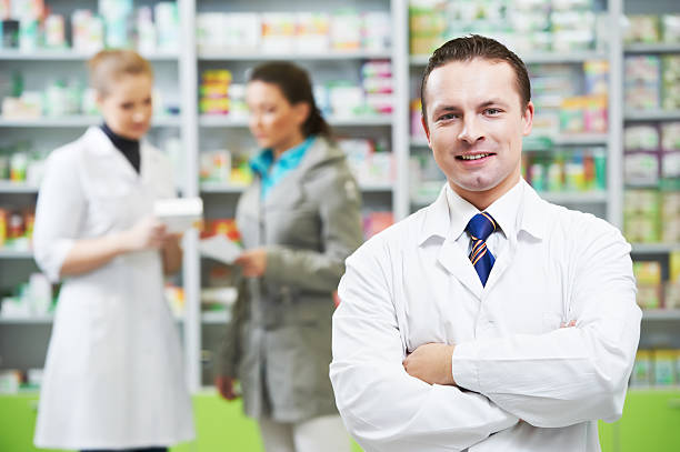 istock Confident pharmacy chemist man in drugstore 140078475